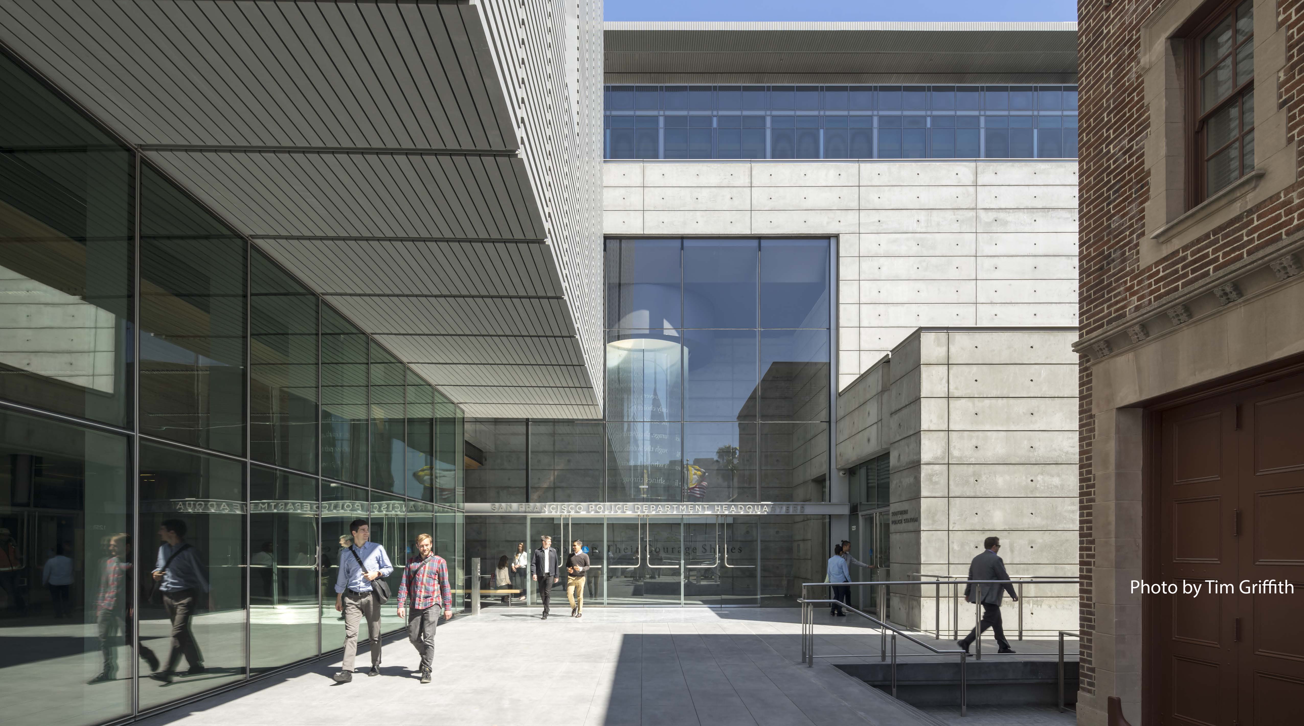 People walk past the San Francisco Public Safety Building.